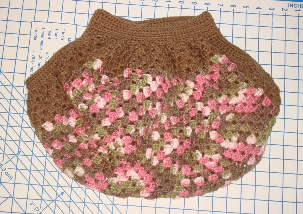 Tops and sides are added to lined granny square.