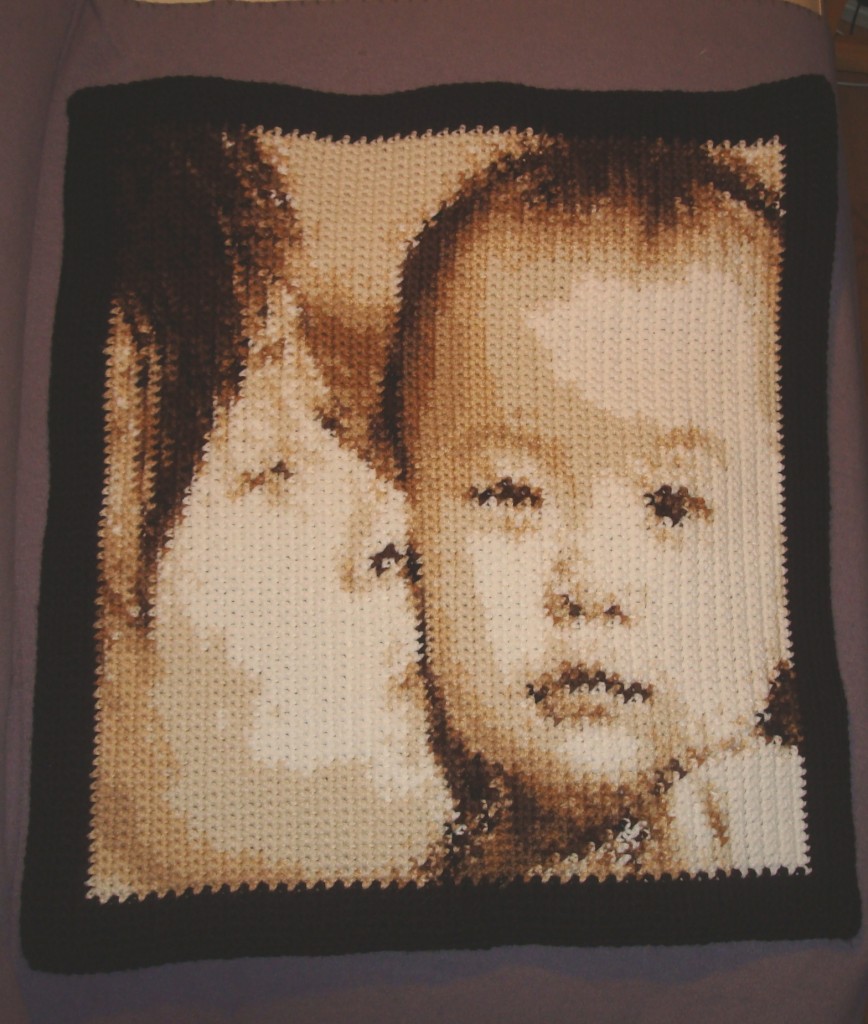 Mom's kissing her baby. Get the pattern here.